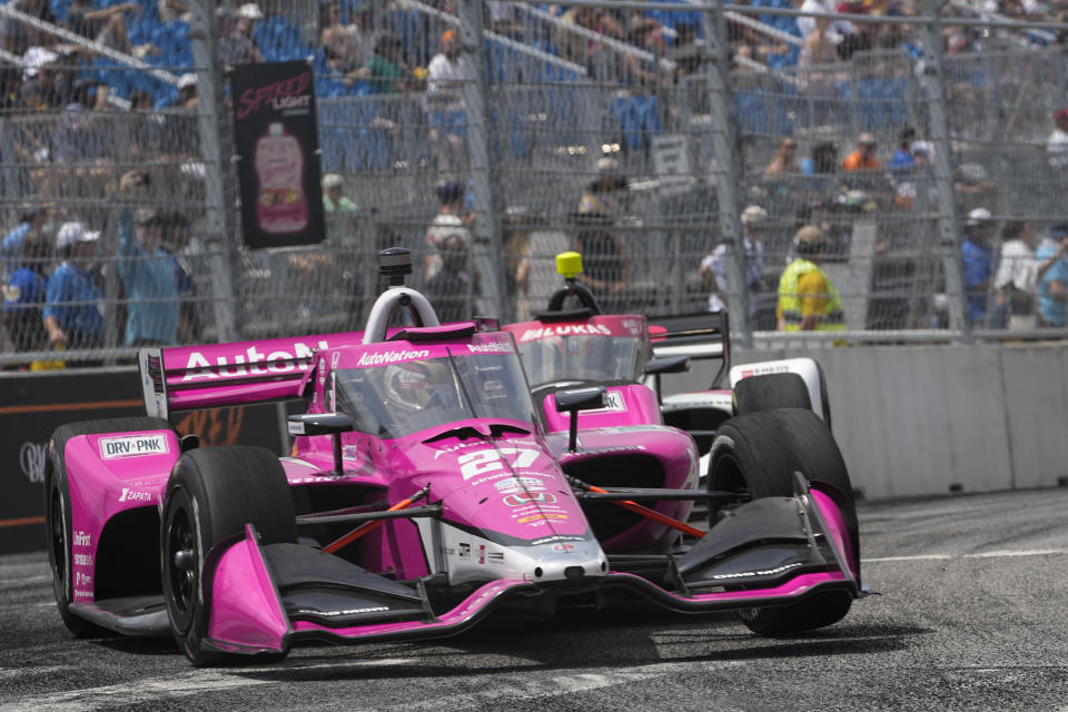 Kyle Kirkwood (27) leads David Malukas as they head into Turn 9 during the Music City Grand Prix auto race Sunday, Aug. 6, 2023, in Nashville, Tenn. (AP Photo/George Walker IV)