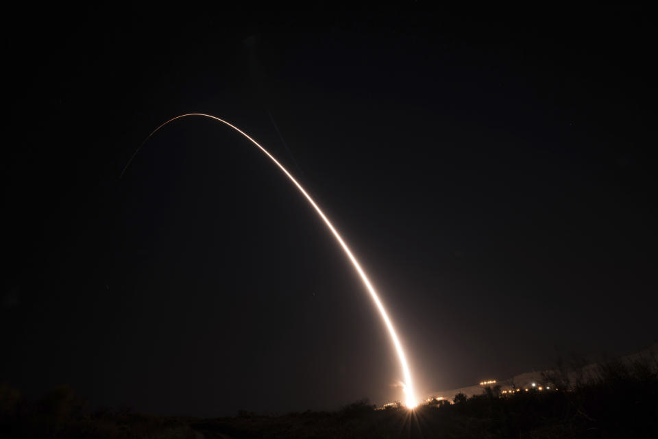 This image taken with a slow shutter speed and provided by the U.S. Air Force shows an unarmed Minuteman III intercontinental ballistic missile test launch early Tuesday, Oct. 2, 2019, at Vandenberg Air Force Base, Calif. (Michael Peterson/U.S. Air Force via AP)