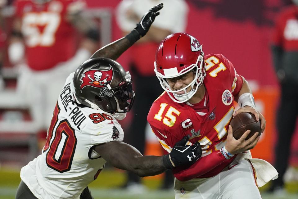 Kansas City Chiefs quarterback Patrick Mahomes breaks away from Tampa Bay Buccaneers outside linebacker Jason Pierre-Paul during the second half of the NFL Super Bowl 55 football game Sunday, Feb. 7, 2021, in Tampa, Fla. (AP Photo/Ashley Landis)