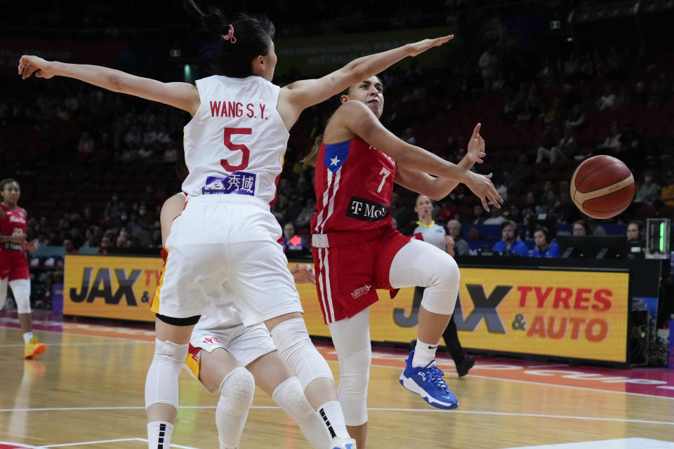 China's Yang Liwei, left, knocks the ball away from Puerto Rico's Zaida Gonzalez during their game at the women's Basketball World Cup in Sydney, Australia, Monday, Sept. 26, 2022. (AP Photo/Mark Baker)