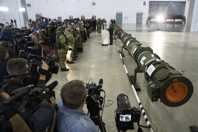 Foreign military attaches and journalists attend a briefing by the Russian Defence Ministry on the 9M729 land-based cruise missile, right, in Kubinka outside Moscow