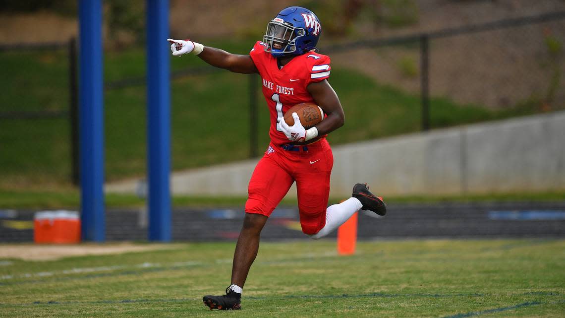 Wake Forest’s Nigel Lucas (1) celebrates after running foe the touchdown in the first quarter. The Wake Forest Cougars and the Southern Durham Spartans met in a football game in Wake Forest, N.C. on August 19, 2022.