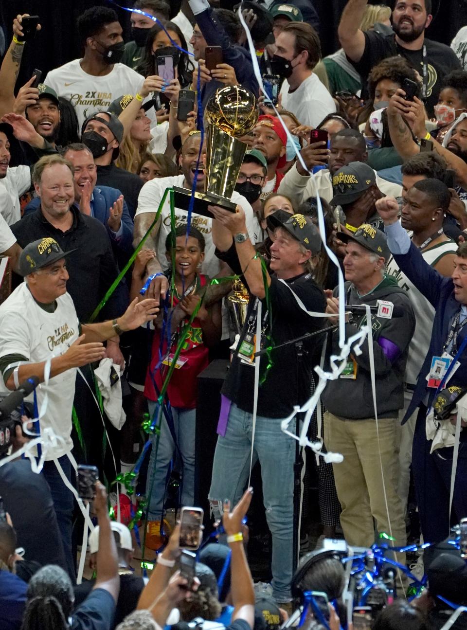 Bucks owner Wes Edens holds Larry O'Brien NBA Championship Trophy after the Bucks won Game 6 of the NBA Finals at Fiserv Forum in Milwaukee on Tuesday, July 20, 2021.