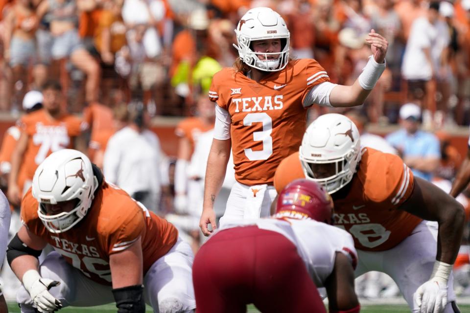 Texas quarterback Quinn Ewers signals at the line of scrimmage during his team's game in 2022 against Iowa State at Darrell K Royal-Texas Memorial Stadium.