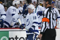 Tampa Bay Lightning's Ondrej Palat (18) returns to the bench after scoring during the second period of an NHL hockey game against the Pittsburgh Penguins in Pittsburgh, Tuesday, Oct. 26, 2021. (AP Photo/Gene J. Puskar)