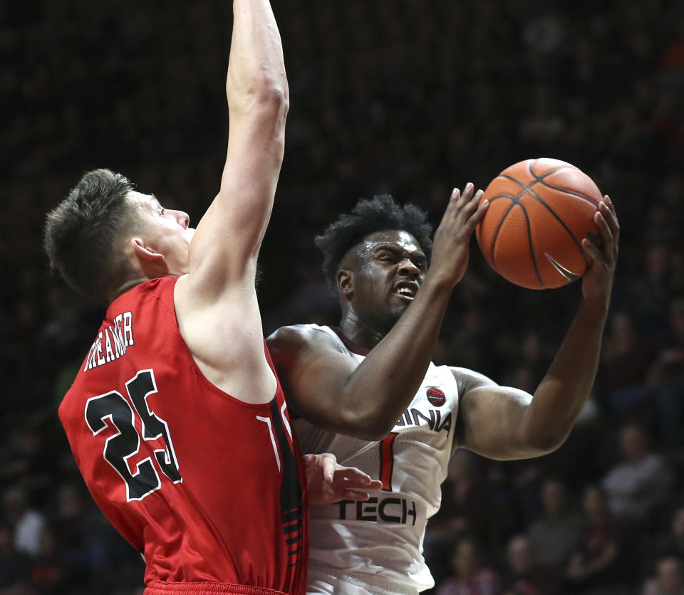 Virginia Tech's Isaiah Wilkins (1) drives to the basket and scores past Virginia Military Institute's defender Tyler Creammer (25) in the second half of an NCAA college basketball game Saturday, Dec. 21 2019, in Blacksburg, Va. (Matt Gentry/The Roanoke Times via AP)