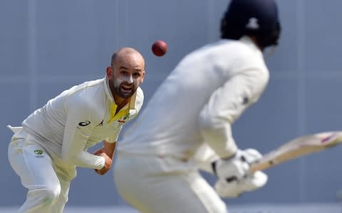 Nathan Lyon bowls to James Vince on day one - Credit: AFP