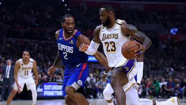 PHOTO: LeBron James #23 of the Los Angeles Lakers drives to the basket on Kawhi Leonard #2 of the LA Clippers during a 112-103 Lakers win at Staples Center on March 8, 2020 in Los Angeles, California. (Harry How/Getty Images)