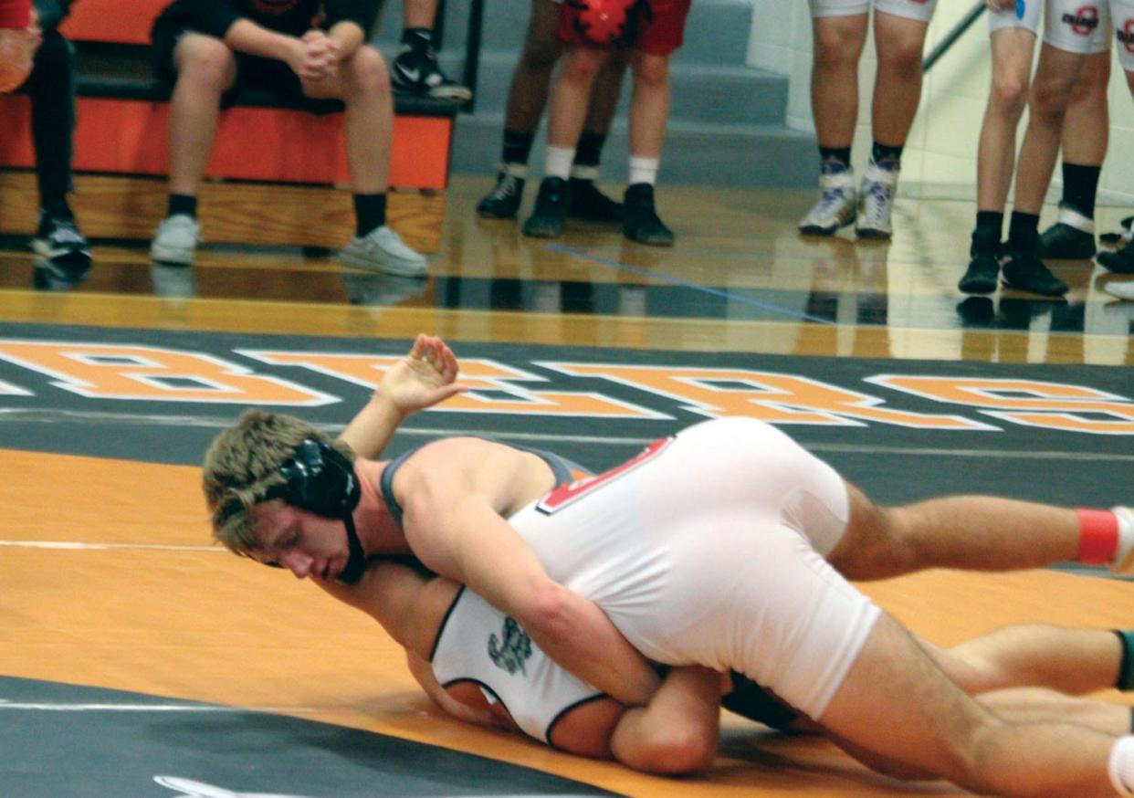 Macomb's Max Ryner gets a turn for a fall.