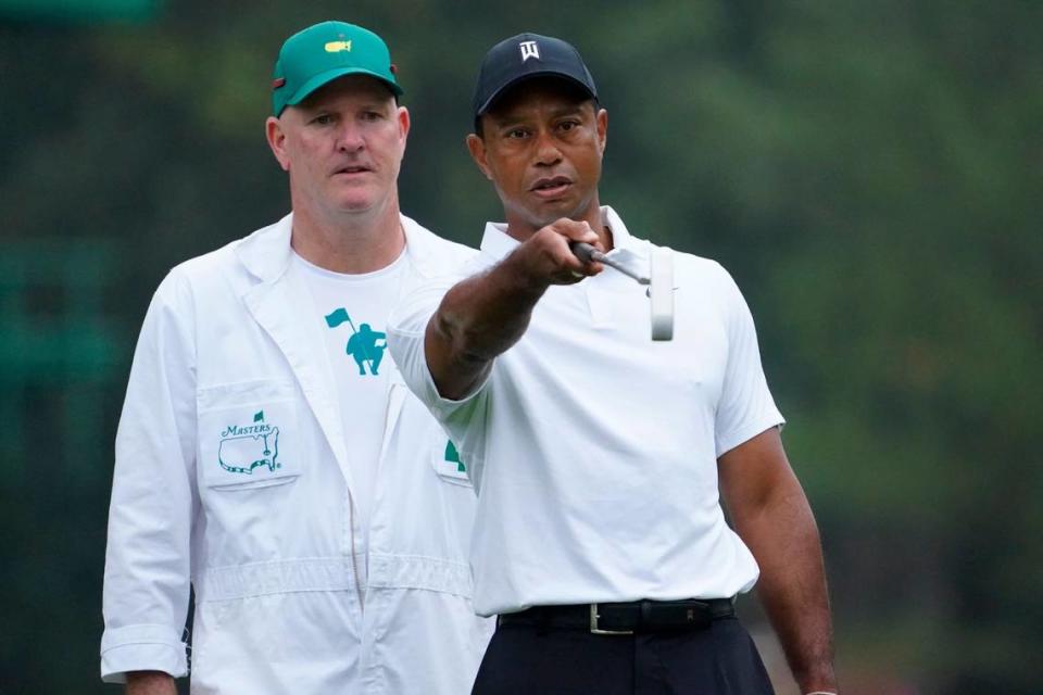 Tiger Woods (right) talks with caddie Joe LaCava during a practice round at Augusta National. LaCava, who now caddies for Patrick Cantlay, was Woods’ caddie for about a decade, including when Woods won the 2019 Masters. Danielle Parhizkaran/USA TODAY