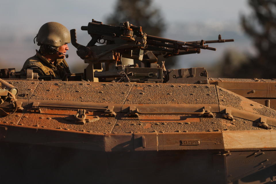 An Israeli soldier looks out from a tank during a military drill near Israel's border with Lebanon in northern Israel, October 26, 2023. REUTERS/Lisi Niesner