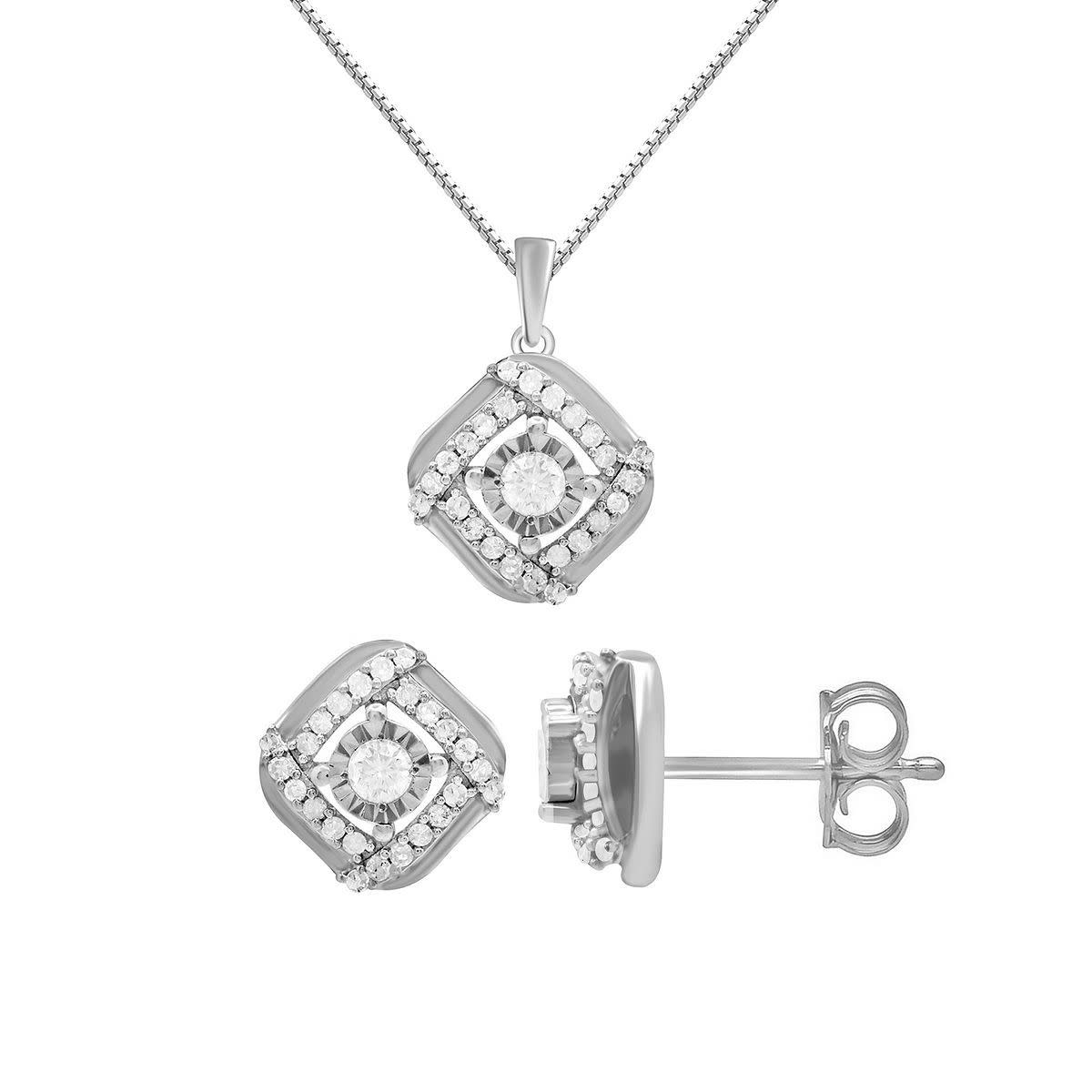 three piece set of diamond earrings and a pendant