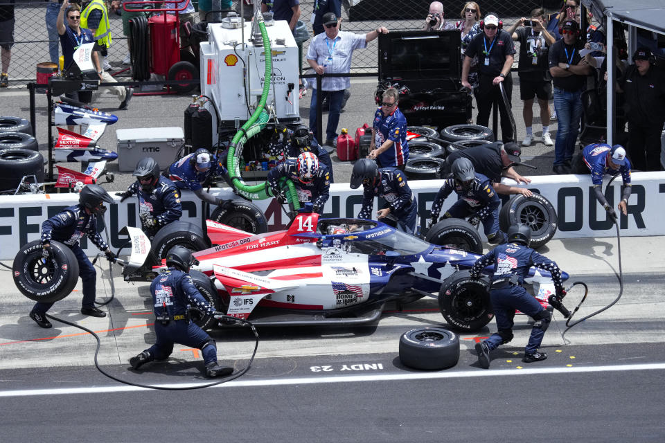 Santino Ferrucci makes a pit stop during the Indianapolis 500 auto race at Indianapolis Motor Speedway in Indianapolis, Sunday, May 28, 2023. (AP Photo/AJ Mast)