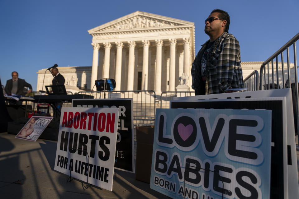 People gather at an anti-abortion rally outside of the Supreme Court in Washington, Tuesday, Nov. 30, 2021, as activists begin to arrive ahead of arguments on abortion at the court in Washington.(AP Photo/Andrew Harnik)