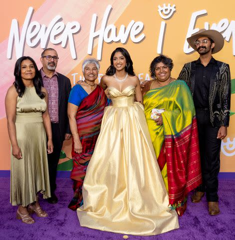 <p>Emma McIntyre/WireImage</p> Maitreyi Ramakrishnan (center) and her family attend Netflix's "Never Have I Ever" Season 4 Premiere Screening Event at Regency Village Theatre on June 01, 2023 in Los Angeles, California.