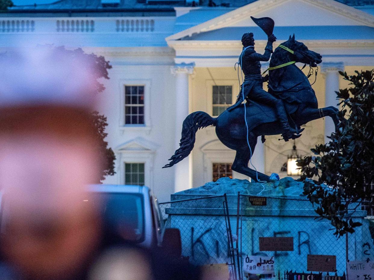 The equestrian statue of former US President General Andrew Jackson has ropes and chains still hanging, after protesters tried to topple it, at Lafayette square, in front of the White House, in Washington, DC on June 22, 2020: AFP via Getty Images