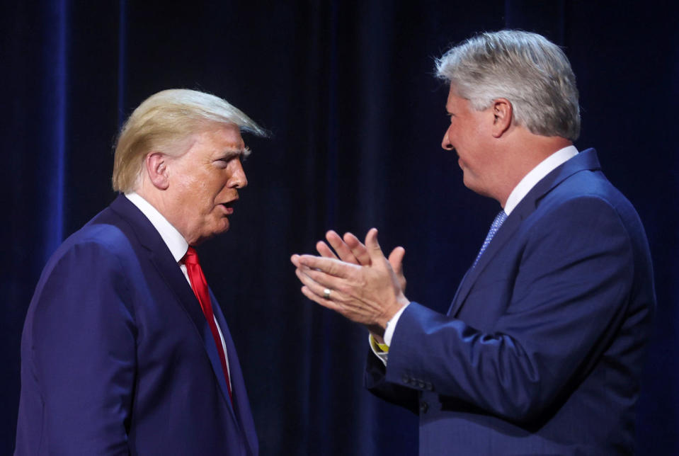 President Donald Trump is greeted by Pastor Robert Morris at Gateway Church (Jonathan Ernst / Reuters file)