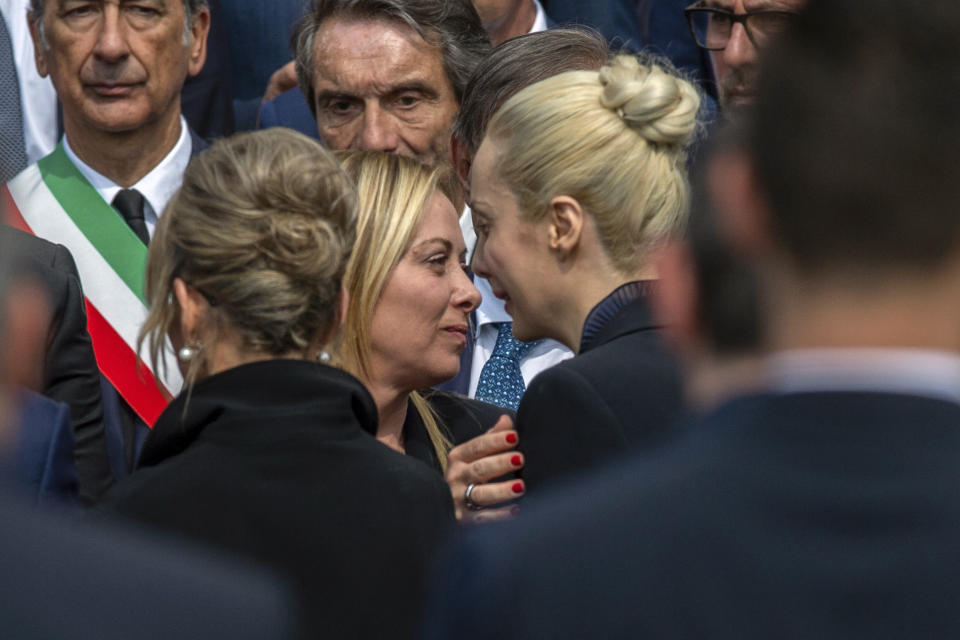 Italian Premier Giorgia Meloni, center left, comforts Marta Fascino, partner of former Italian premier Silvio Berlusconi, at the end of his state funeral in Milan's Duomo Gothic-era Cathedral, Italy, Wednesday, June 14, 2023. Berlusconi died at the age of 86 on Monday in a Milan hospital where he was being treated for chronic leukemia. (Claudio Furlan/LaPresse via AP)