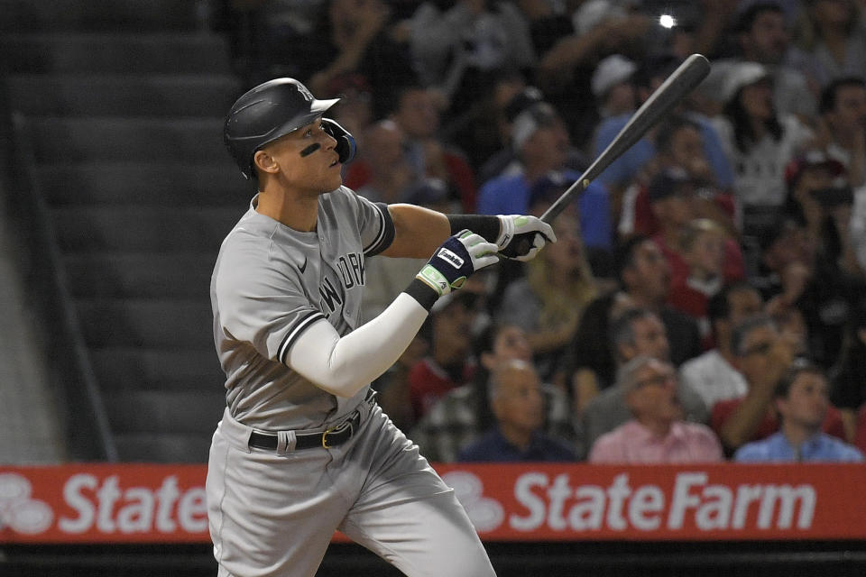 New York Yankees' Aaron Judge hits a solo home run during the eighth inning of a baseball game against the Los Angeles Angels Monday, Aug. 29, 2022, in Anaheim, Calif. This was Judge's 50th home run of the season. (AP Photo/Mark J. Terrill)