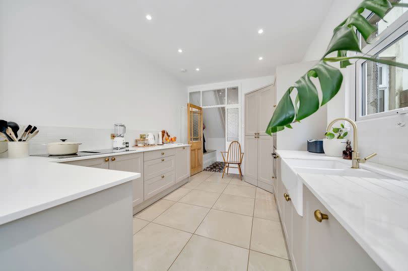 AFTER: By combining the third reception room with the old kitchen, pantry and outhouse a fantastic kitchen diner has been created