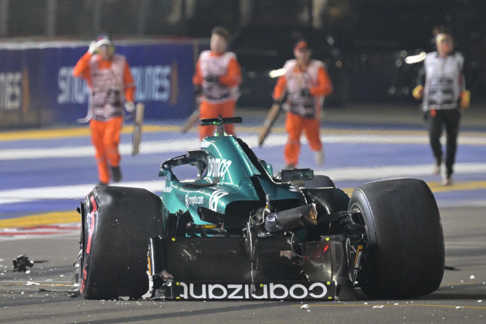 The car of Aston Martin driver Lance Stroll of Canada after a crash during the qualifying session of the Singapore Formula One Grand Prix at the Marina Bay circuit, Singapore, Saturday, Sept. 16, 2023. (Caroline Chia/Pool Photo via AP)