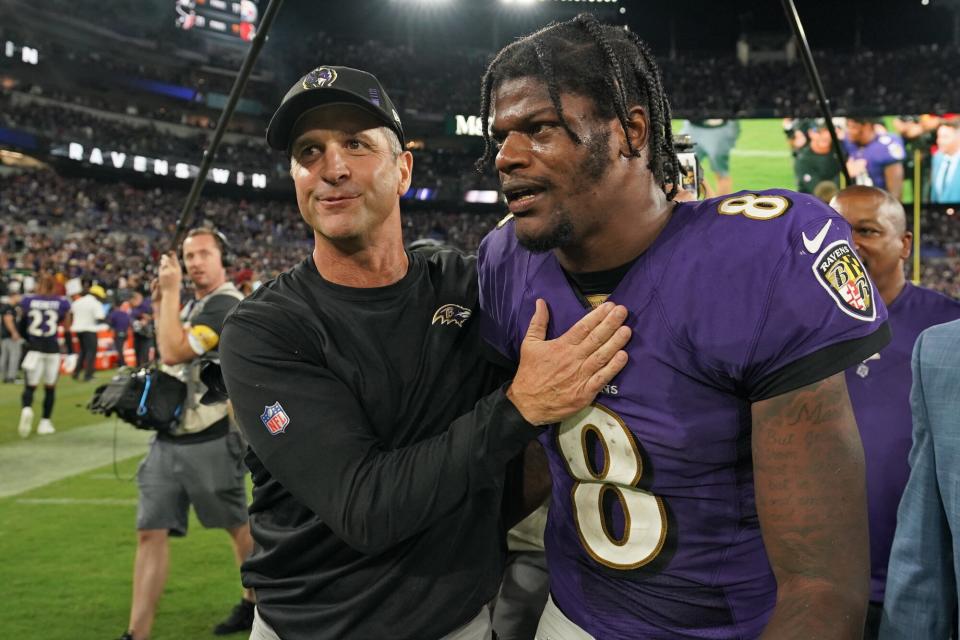 Lamar Jackson #8 of the Baltimore Ravens hugs head coach John Harbaugh against the Kansas City Chiefs after an NFL game at M&T Bank Stadium on September 19, 2021 in Baltimore, Maryland.