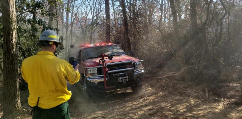 Firefighters make their way up to the front lines of the Poplar Drive Fire on Nov. 8, which was the sixth day of the fire.