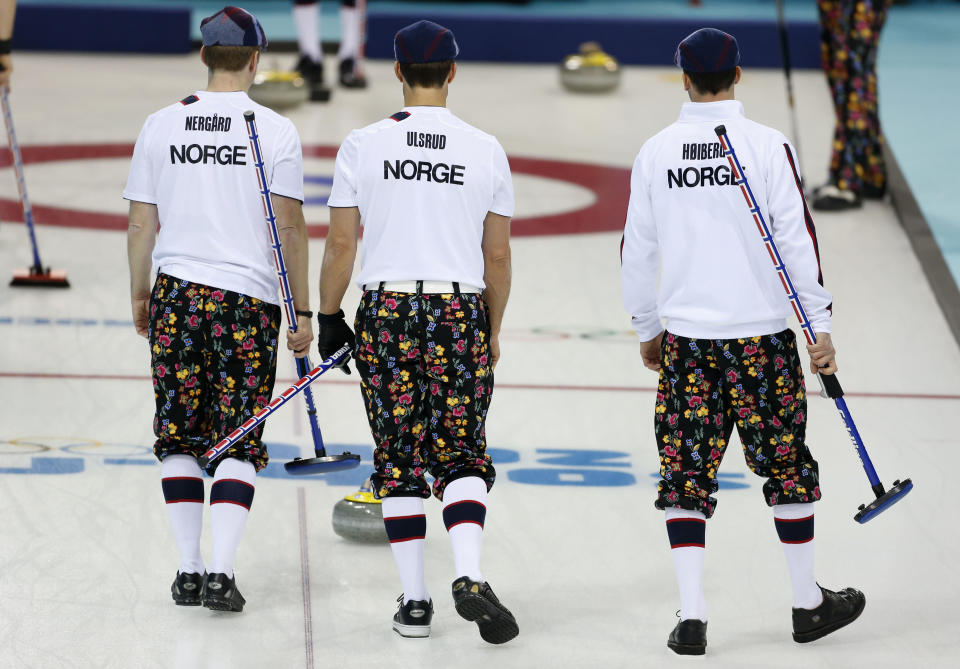 Norwegian curlers wear rose-painting knickers during curling training at the 2014 Winter Olympics, Saturday, Feb. 8, 2014, in Sochi, Russia. (AP Photo/Robert F. Bukaty)