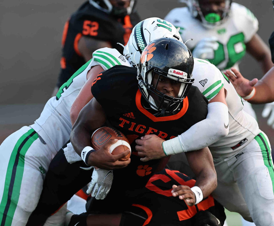 Withrow quarterback Troy Montgomery (11) runs the ball during a football game between Withrow and Badin high schools Friday, Sept. 2, 2022.