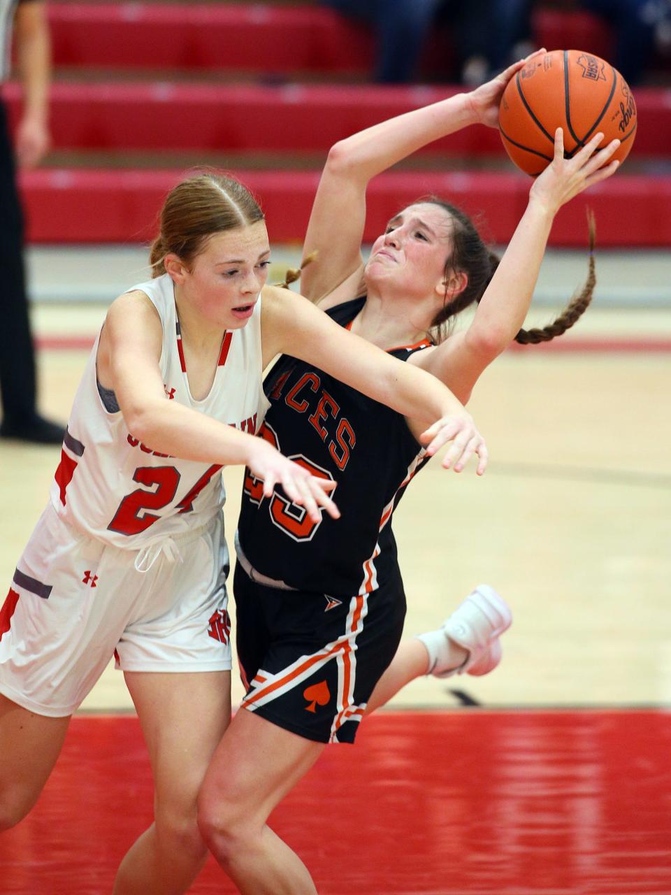 Amanda-Clearcreek sophomore Taylor Evans attempts to slip past Johnstown freshman Amelia Bonito on Wednesday.