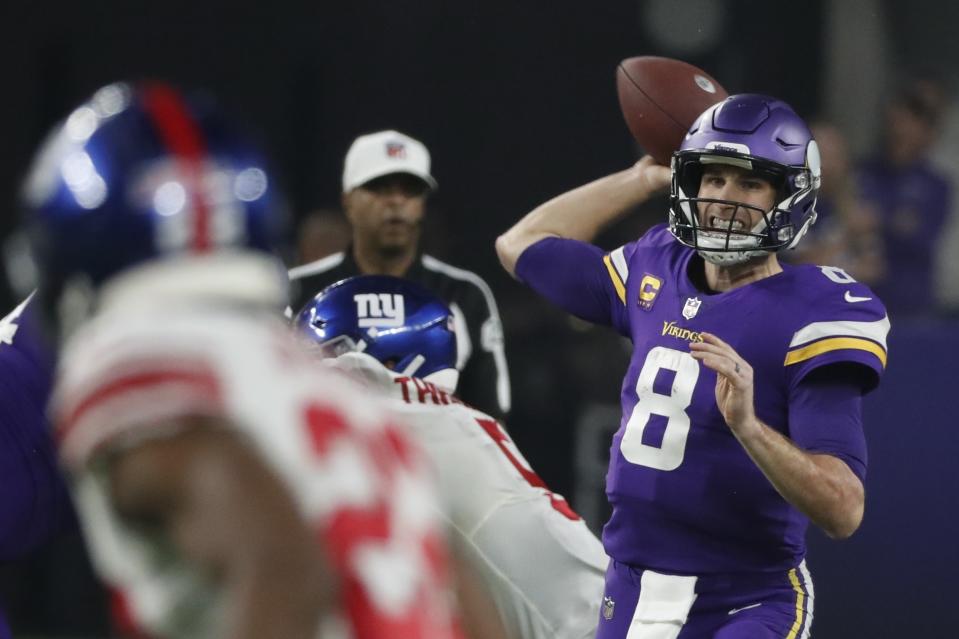 Minnesota Vikings' Kirk Cousins thorws during the second half of an NFL wild card football game against the New York Giants Sunday, Jan. 15, 2023, in Minneapolis. (AP Photo/Bruce Kluckhohn)