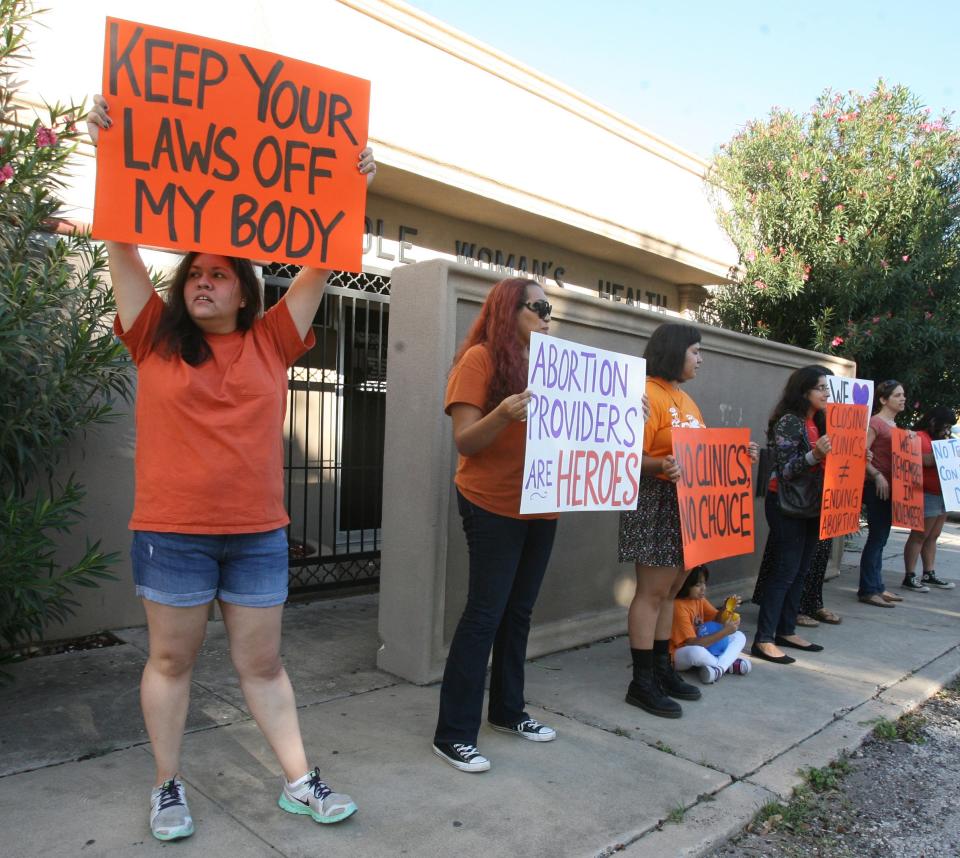 People demonstrate in front of a women's health clinic Oct. 4 in McAllen, Texas.