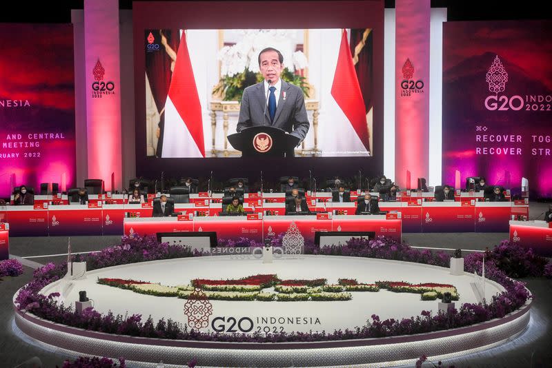 Indonesia President Joko Widodo is seen on a screen delivering his speech during G20 finance ministers and central bank governors meeting (FMCBG) at Jakarta Convention Center