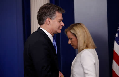 FBI Director Christopher Wray approaches the podium after Department of Homeland Security (DHS) Secretary Kirstjen Nielsen spoke during a briefing on election security in the White House press briefing room at the White House in Washington, U.S., August 2, 2018. REUTERS/Carlos Barria