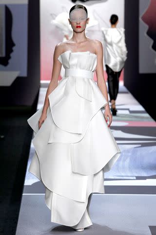 Dutch designers Viktor & Rolf are a long shot for Middleton, but Marie Claire Style Director Taylor Tomasi Hill thinks this dress could be ideal: "It  is perfect for accentuating her slim shoulders but still conservative enough for a church setting.