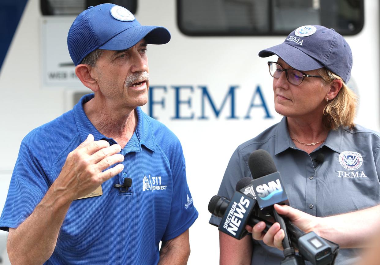 Sarasota County Commissioner Ron Cutsinger talks to the media along with FEMA Administrator Deanne Criswell after visiting with survivors of Hurricane Ian's flood and wind damage on Saturday Oct.15, 2022 in North Port.