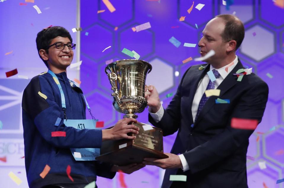 Karthik Nemmani, 14, from McKinney, Texas, holds the Scripps National Spelling Bee Championship Trophy (AP)