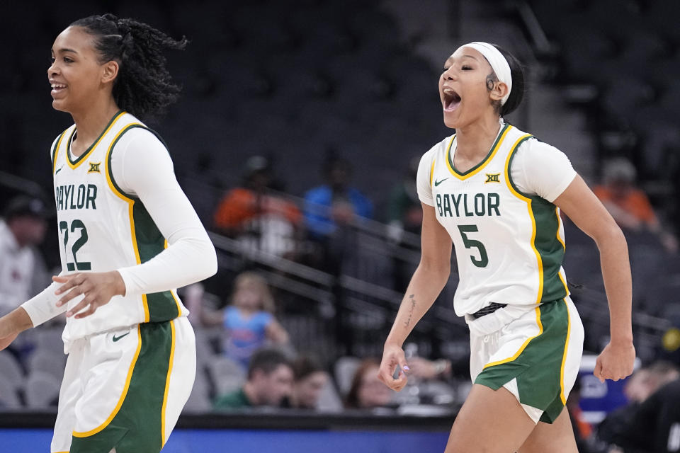 Baylor guard Bella Fontleroy (22) and guard Darianna Littlepage-Buggs (5) celebrate after a score against Miami during the first half of an NCAA college basketball game in San Antonio, Saturday, Dec. 16, 2023. (AP Photo/Eric Gay)