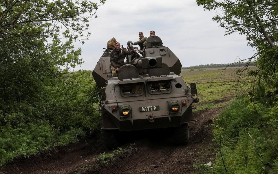 Ukrainian service members from a 110th Separate Mechanised Brigade of the Armed Forces of Ukraine, ride a self-propelled howitzer "Dana", amid Russia's attack on Ukraine, near the town of Avdiivka in Donetsk region, - Sofiia Gatilova/STRINGER