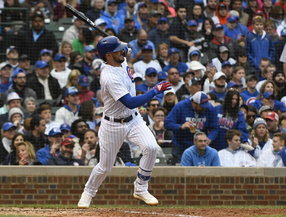 Chicago Cubs' Kris Bryant (17) hits a two RBI double during the fifth inning of a baseball game against the St. Louis Cardinals on Sunday, Sept. 30, 2018, in Chicago. (AP Photo/Matt Marton)