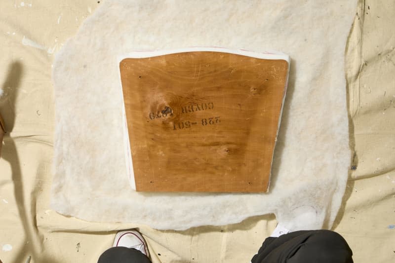 overhead shot of the uncovered seat cushion resting on some batting.