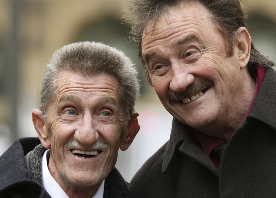 FILE - This Feb. 3, 2014 file photo shows the Chuckle Brothers, Barry, left, and Paul Elliott in London. British children's entertainer Barry Chuckle, half of sibling duo the Chuckle Brothers, has died aged 73. Manager Phil Dale said Sunday, Aug. 5, 2018 that Chuckle, whose real name was Barry Elliott, died at home after an illness. Barry and his younger brother Paul starred in TV show "ChuckleVision," which ran on the BBC between 1987 and 2009. (Yui Mok/PA via AP, File)