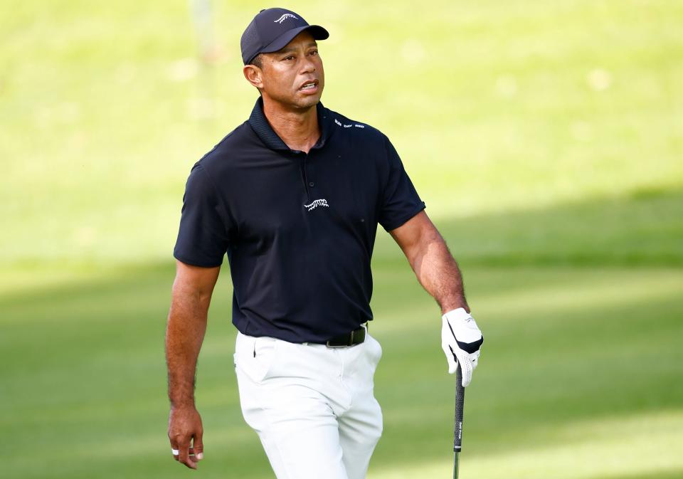 PACIFIC PALISADES, CALIFORNIA - FEBRUARY 13: Tiger Woods of the United States looks on as he practices prior to The Genesis Invitational at Riviera Country Club on February 13, 2024 in Pacific Palisades, California. (Photo by Ronald Martinez/Getty Images)