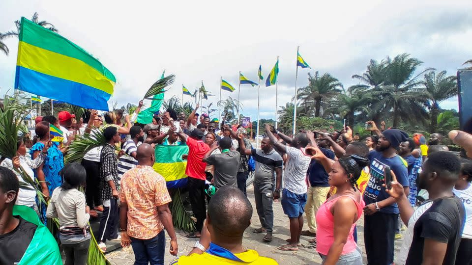People celebrate in support of the military coup leaders in Libreville, Gabon on Wednesday. - Gerauds Wilfried Obangome/Reuters