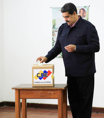 Venezuela's President Nicolas Maduro casts his vote at a polling station during the municipal legislators election in Caracas, Venezuela December 9, 2018. Miraflores Palace/Handout via REUTERS