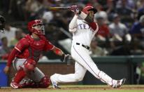 Aug 16, 2018; Arlington, TX, USA; Texas Rangers third baseman Jurickson Profar (19) hits a home run during the sixth inning against the Los Angeles Angels at Globe Life Park in Arlington. Kevin Jairaj-USA TODAY Sports