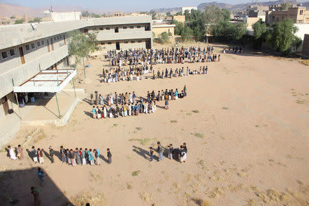 Students perform the morning drills at their school which lost pupils in an August 2018 Saudi-led air strike on a school bus in Saada province, Yemen October 6, 2018. REUTERS/Naif Rahma