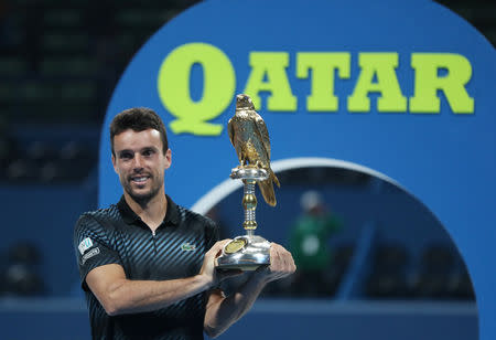 Tennis - ATP - Qatar Open - Khalifa International Tennis and Squash Complex, Doha, Qatar - January 5, 2019 Spain's Roberto Bautista Agut celebrates with the trophy after winning the final against Czech Republic's Tomas Berdych REUTERS/Ibraheem Al Omari