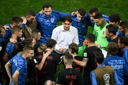 Zlatko Dalic talks to his players before extra-time against England