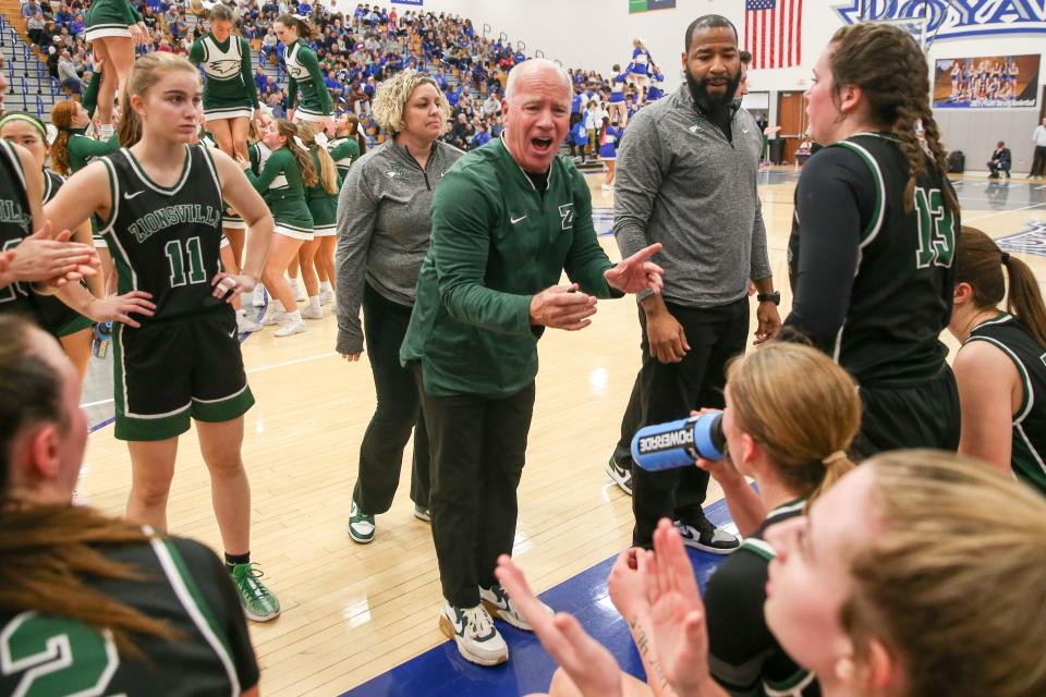 Zionsville Coach Andy Maguire goes over plays between quarters as Zionsville takes on Hamilton Southeastern High School in the S8 IHSAA Class 4A Girls Basketball State Semi-finals; Feb 2, 2024; Fishers, IN, USA; at Hamilton Southeastern High School.